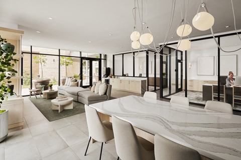 A modern living room with a marble table and white chairs.