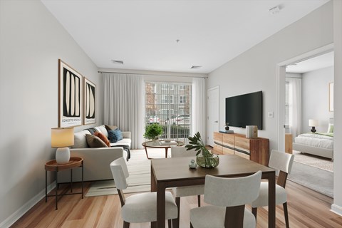 A modern living room with a wooden floor and furniture.