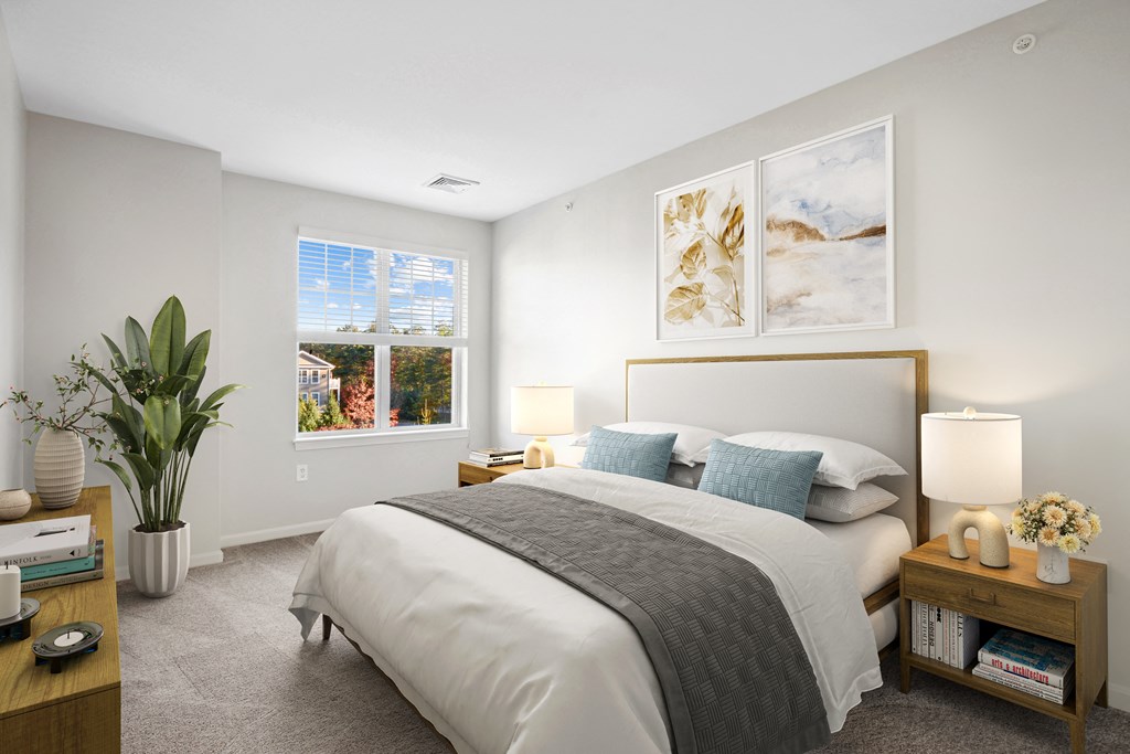 a bedroom with a large bed and a window