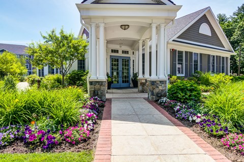 a long walkway leading to the front door leasing office at The Prescott at Concord