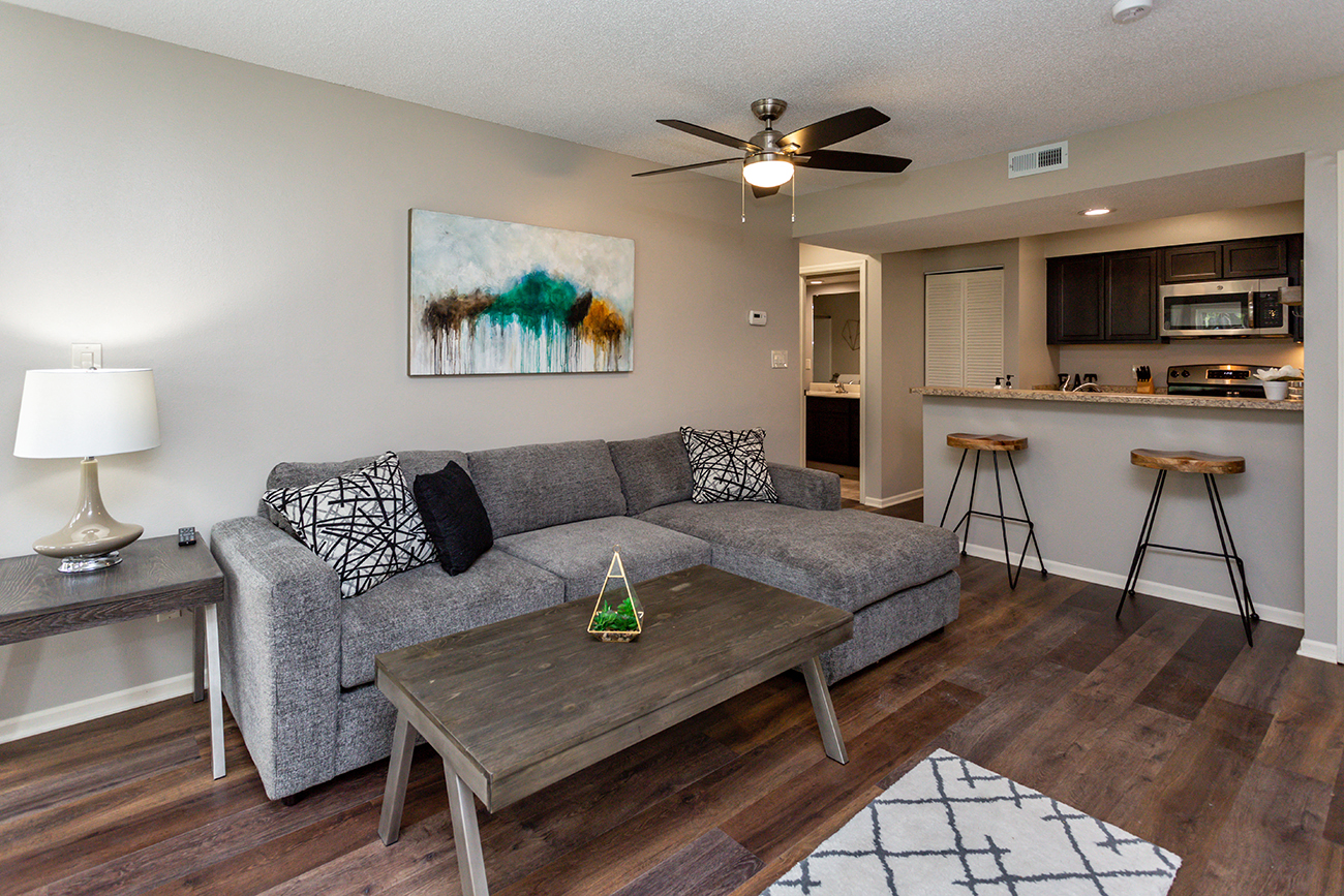 living room connected to kitchen and bathroom