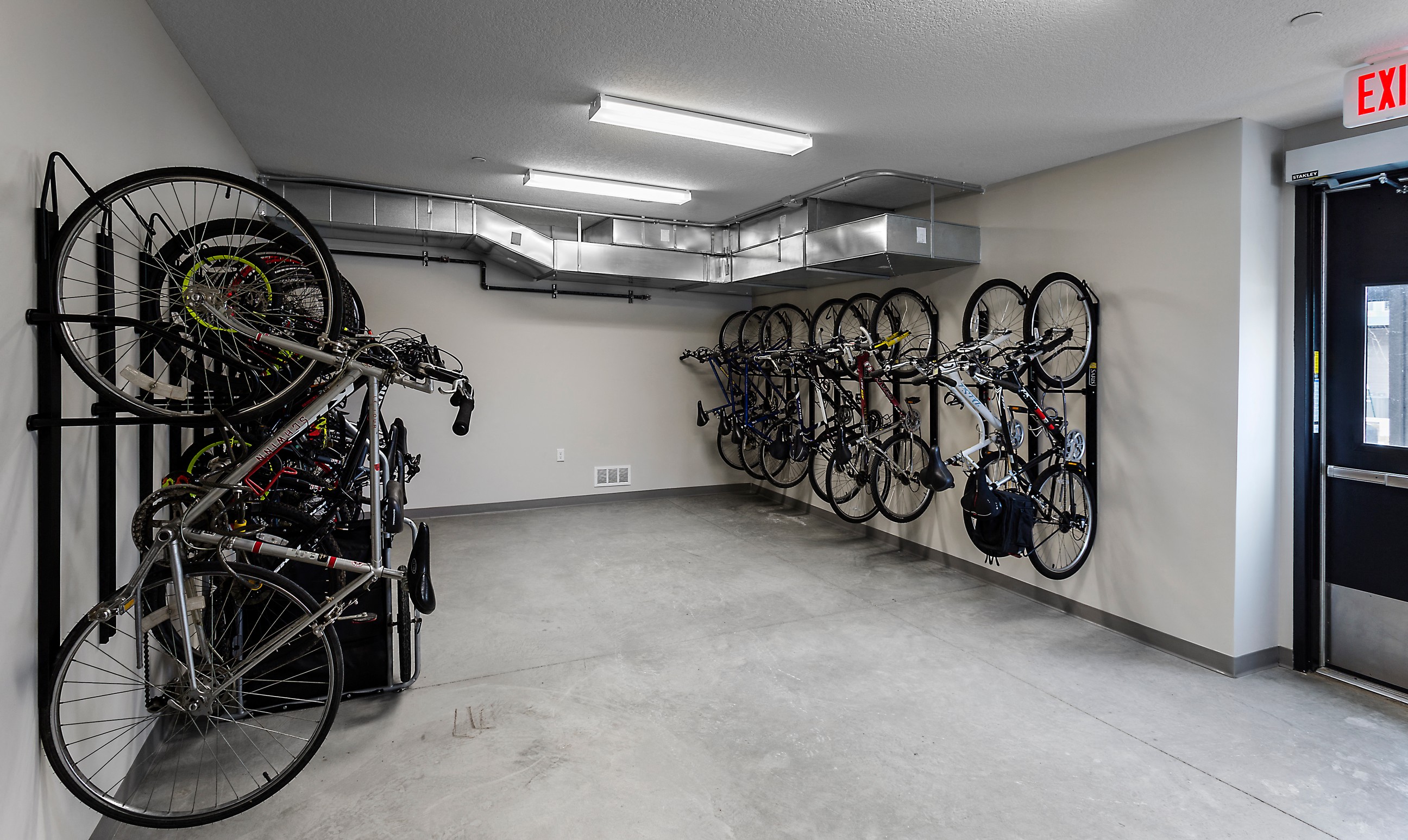 a bike storage facility with several bikes hanging vertically