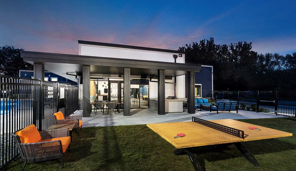 the grove with ping pong table, fireplace, and grill