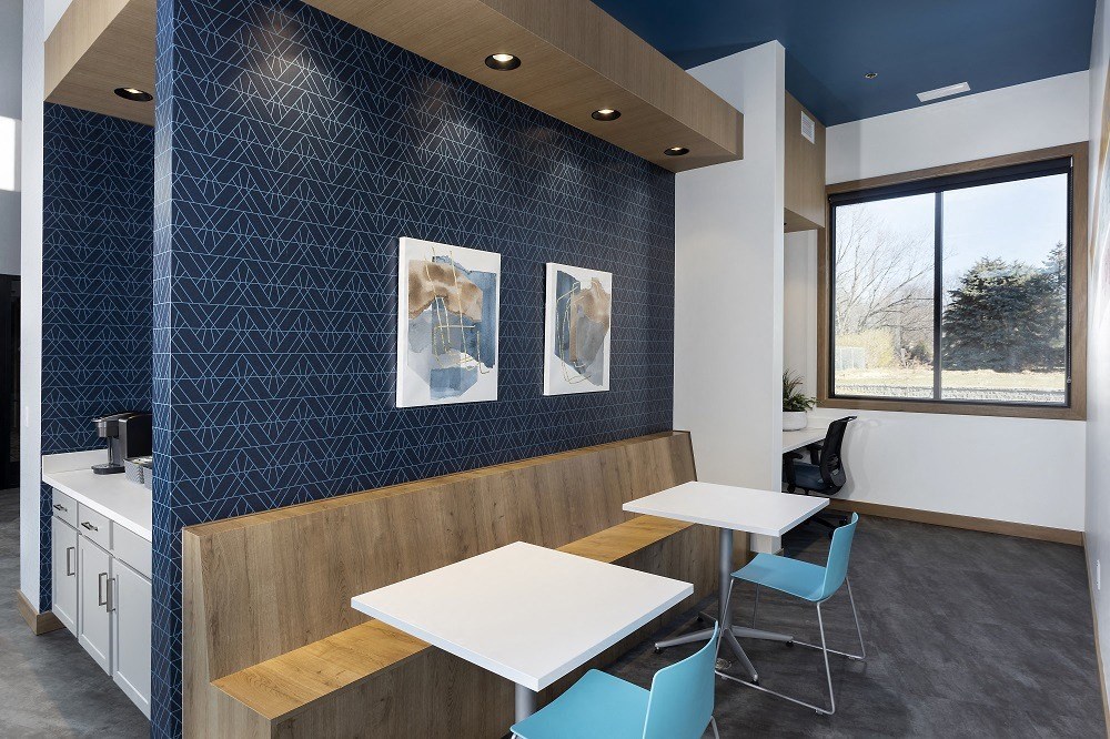 business workspace with bench seating, printer, and computer