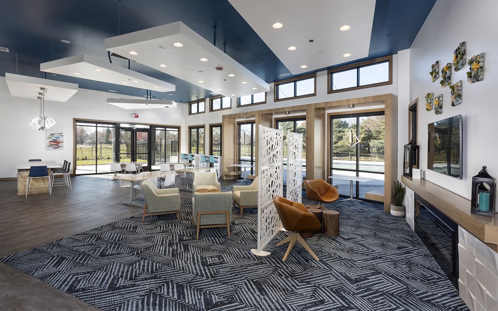 interior clubhouse with tall ceiling and windows