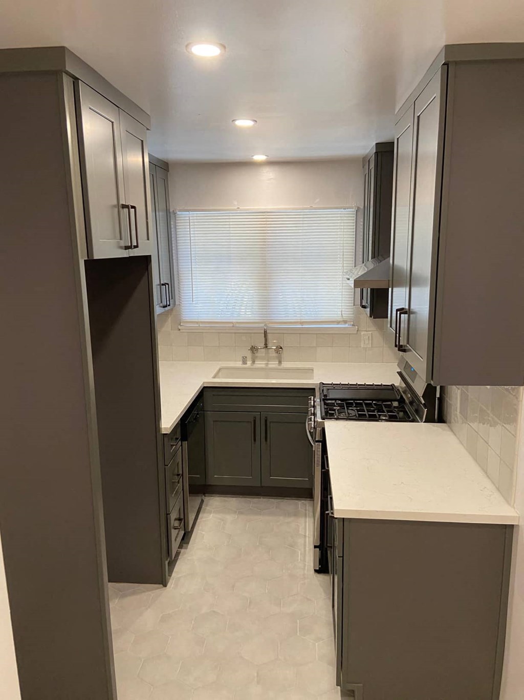 a kitchen with a sink and a window