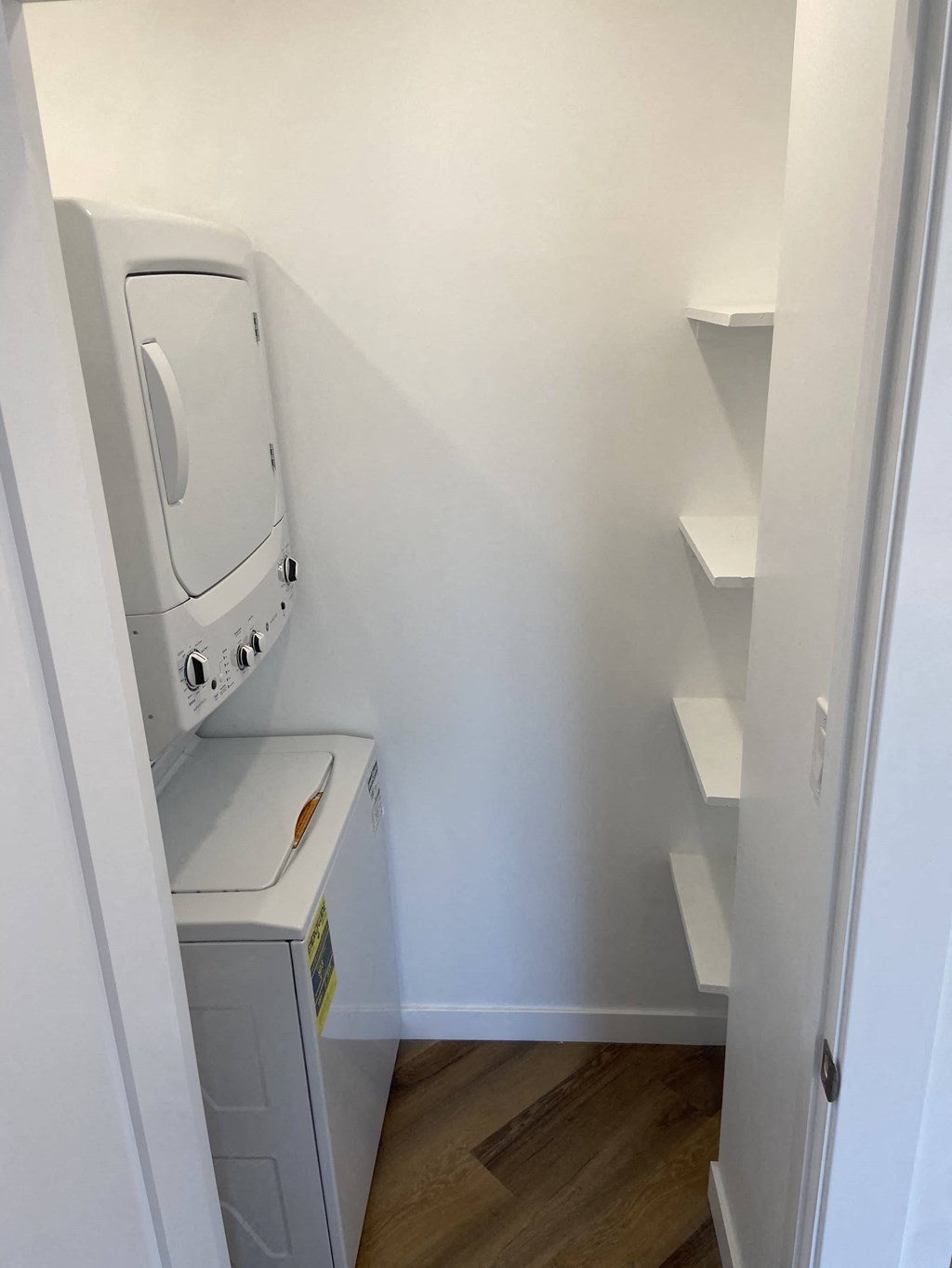 a washer and dryer in a room with a white wall