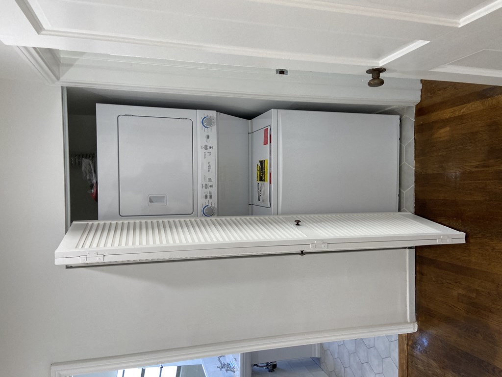 a refrigerator freezer sitting inside of a room