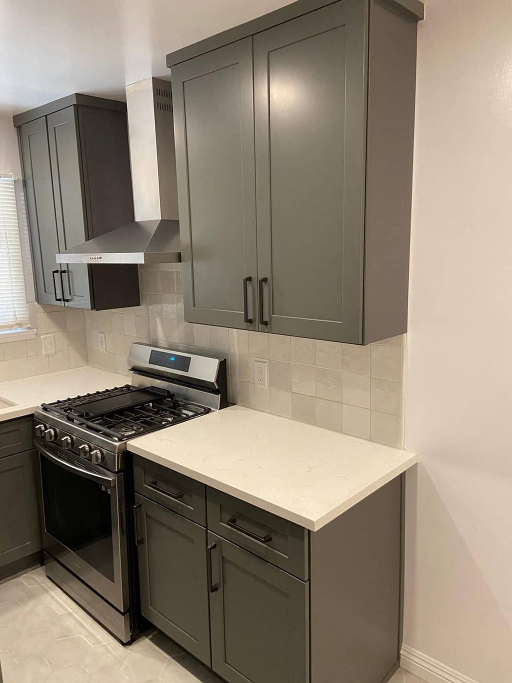 a kitchen with a stove and a counter top