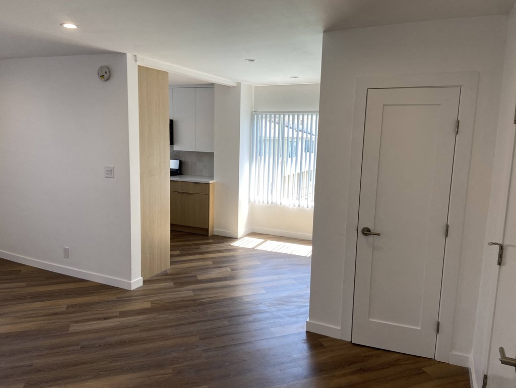a renovated living room and kitchen in a new house