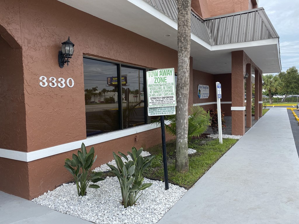 a sign in front of a building at Colonial Drive Apartments, Orlando, FL 32808