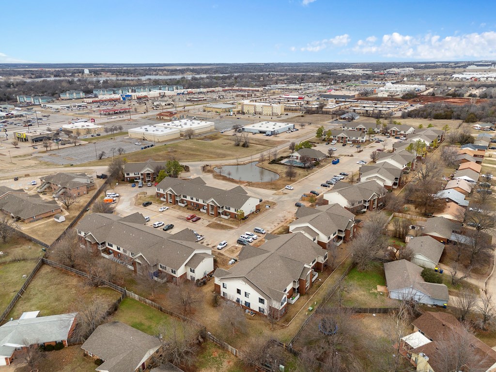 an aerial view of a neighborhood of houses and a parking lot