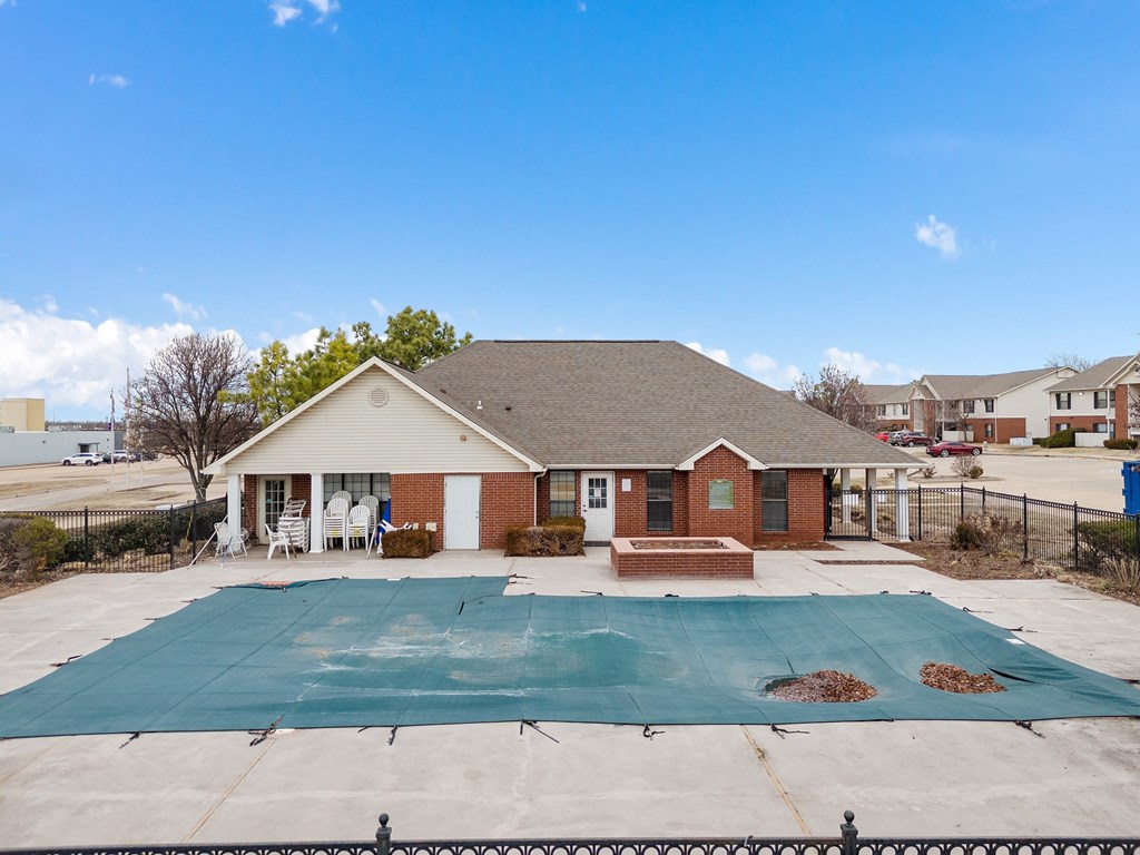 the view of a house with a pool in front of it