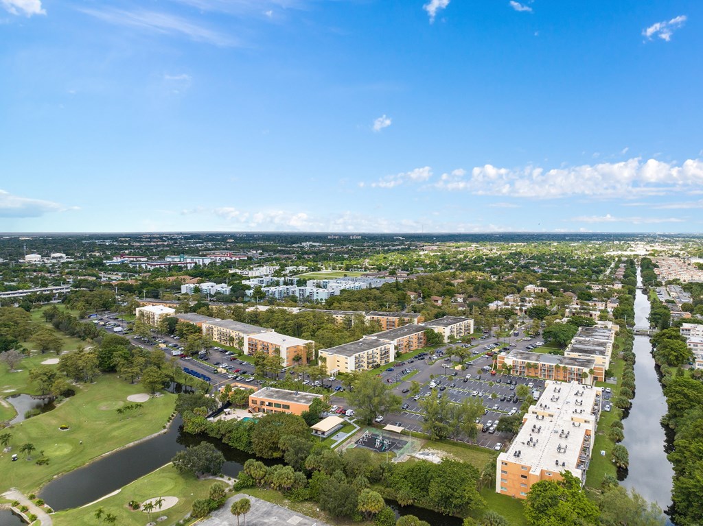 an aerial view of a city with a river and buildings