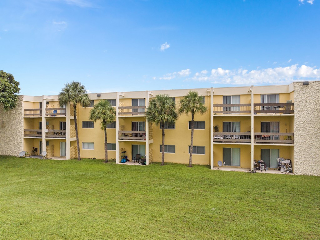 a row of four turbines in a field