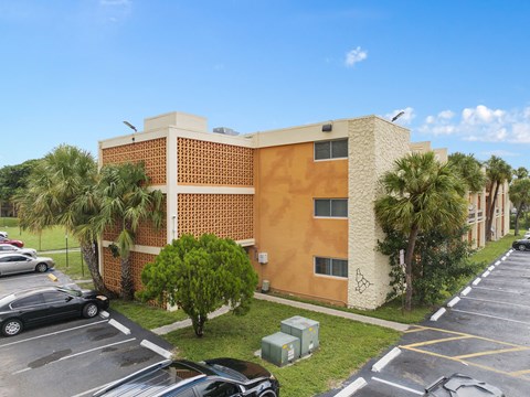 a rendering of a building with a blue sky above it at Cypress Grove, Lauderhill, 33313