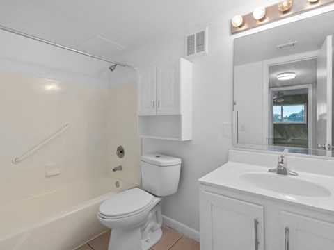 a bathroom with a toilet and a sink and a bath tub at Cypress Grove, Lauderhill, FL, 33313