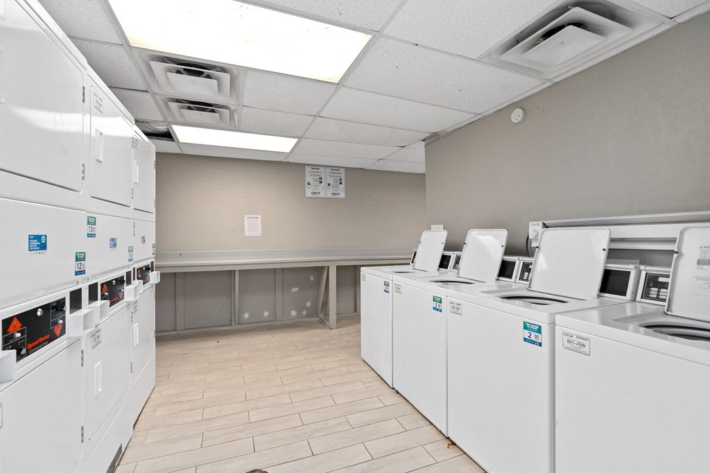 a break room with a bunch of machines and appliances in it