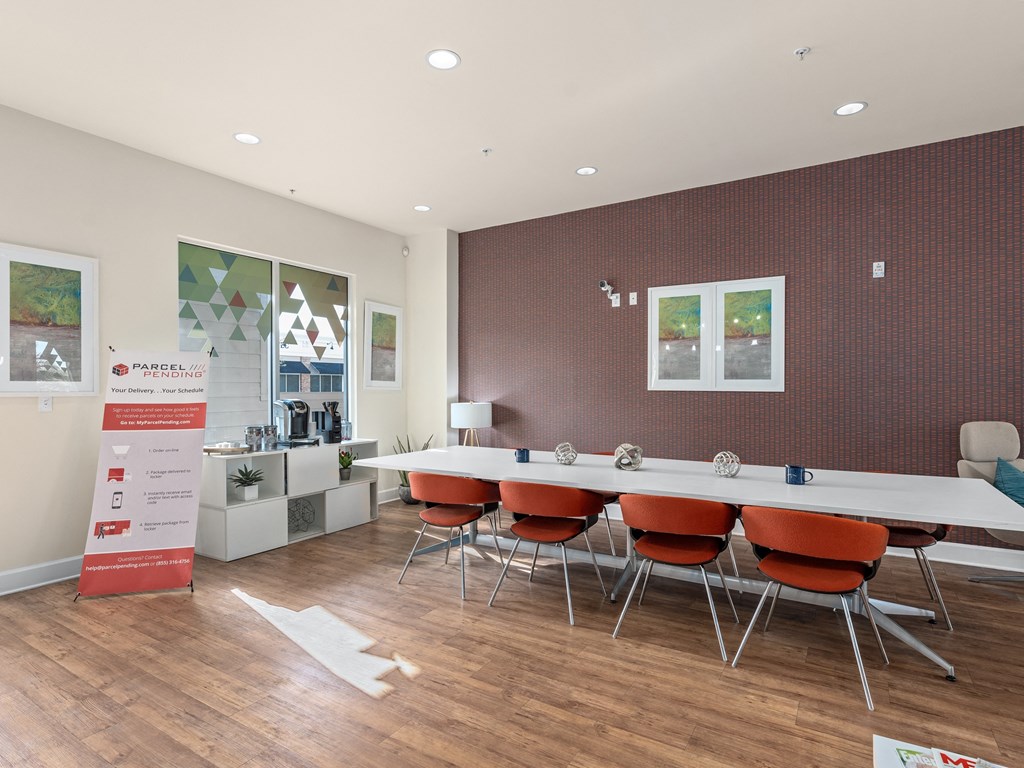 a conference room with a long table and chairs at Lake Lofts at Deerwood, Jacksonville, FL, 32216