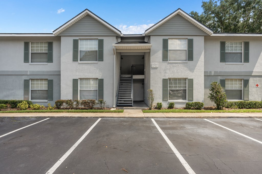 an empty parking lot in front of an apartment building at Oak Reserve at Winter Park, Florida, 32792