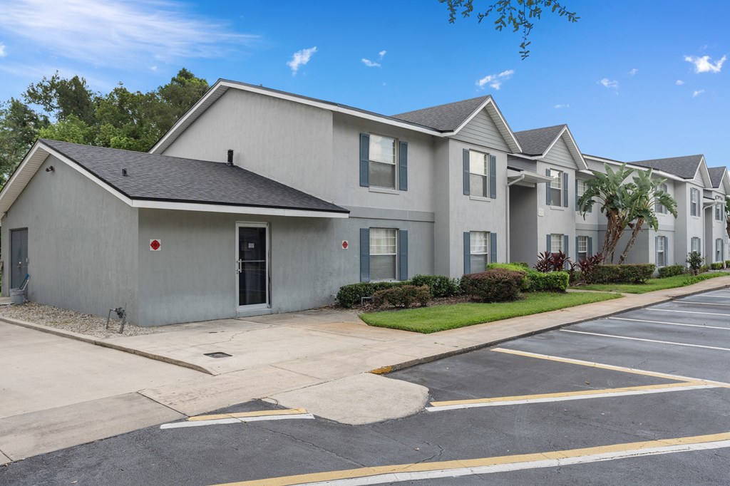 a white house with a street and a parking lot at Oak Reserve at Winter Park, Winter Park, 32792