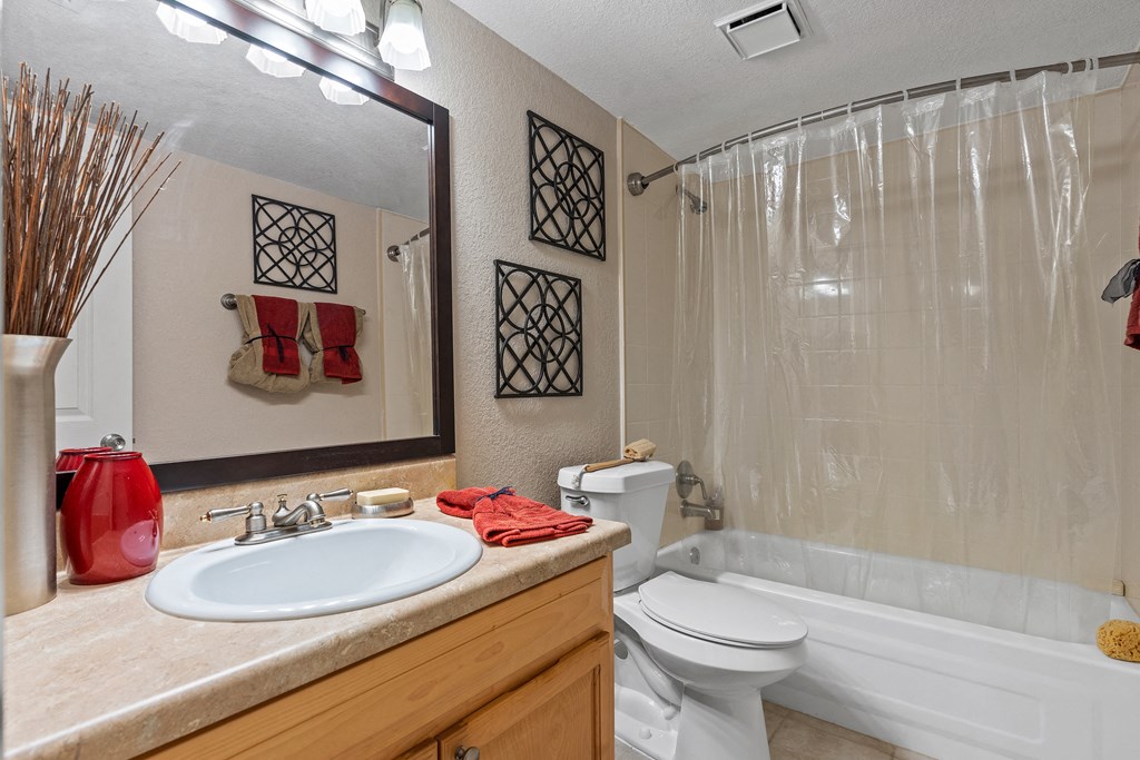 a bathroom with a sink toilet and tub and a shower at Oak Reserve at Winter Park, Florida, 32792