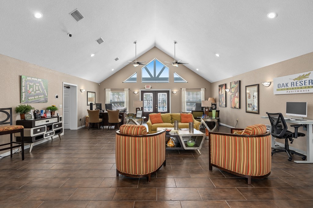 the lobby of a clubhouse with couches and chairs at Oak Reserve at Winter Park, Winter Park