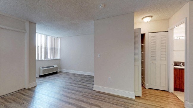 an empty living room with a large window  at Club at Emerald Waters, Florida