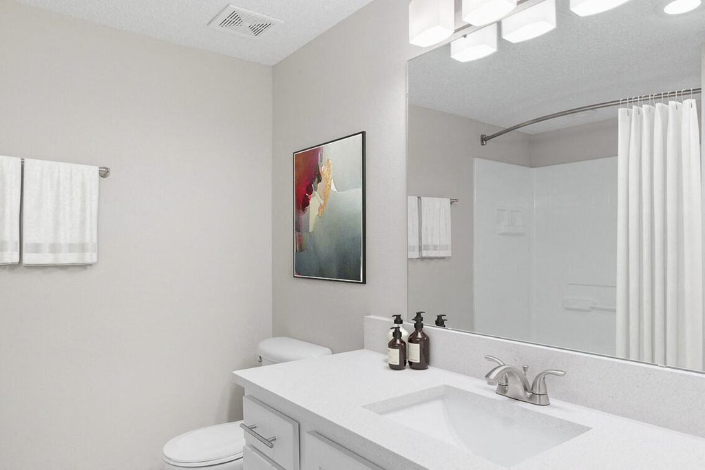 a white bathroom with a sink and a mirror at Lakeside Villas, Orlando, 32817