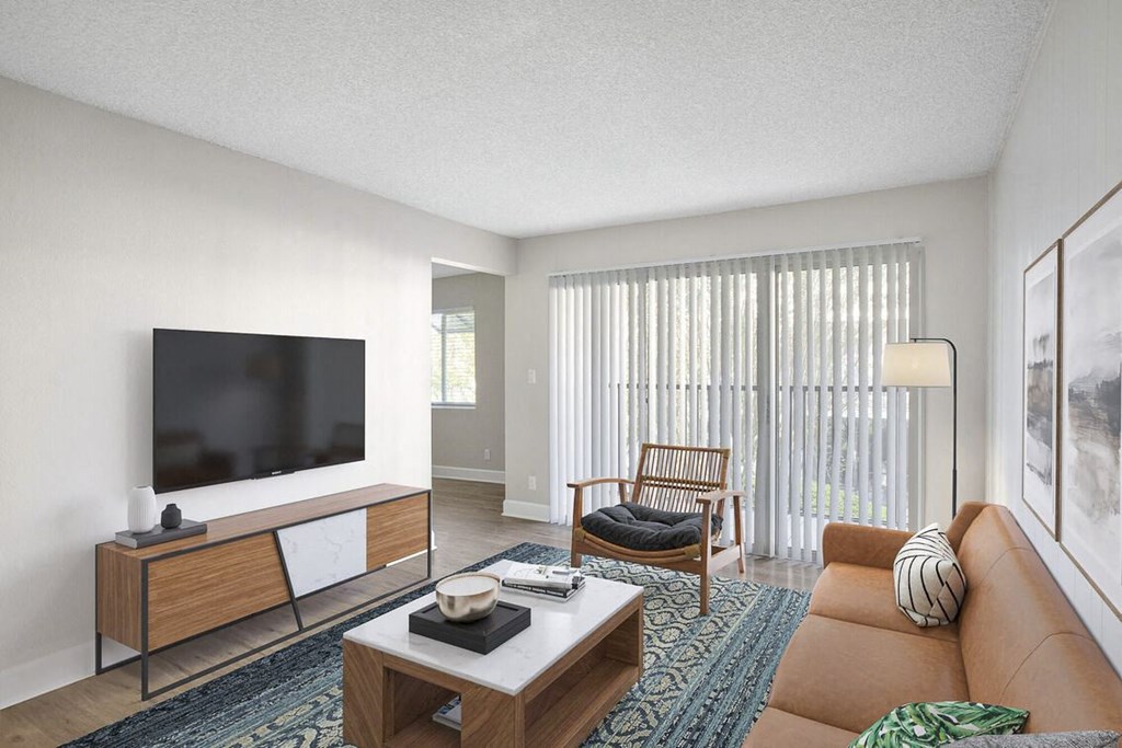 a living room with a couch and a television at Lakeside Villas, Orlando, FL 32817