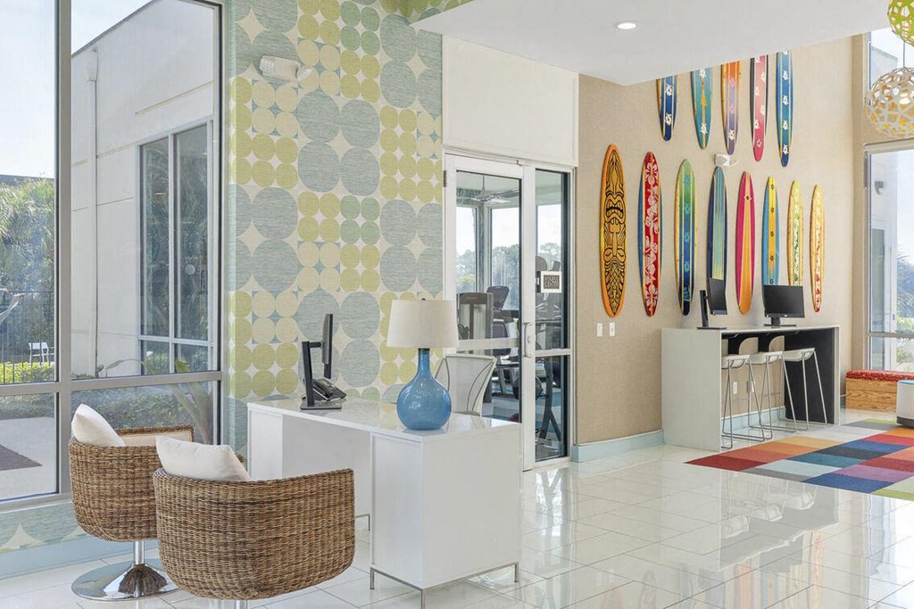 a living room with surfboards on the wall at Lakeside Villas, Orlando