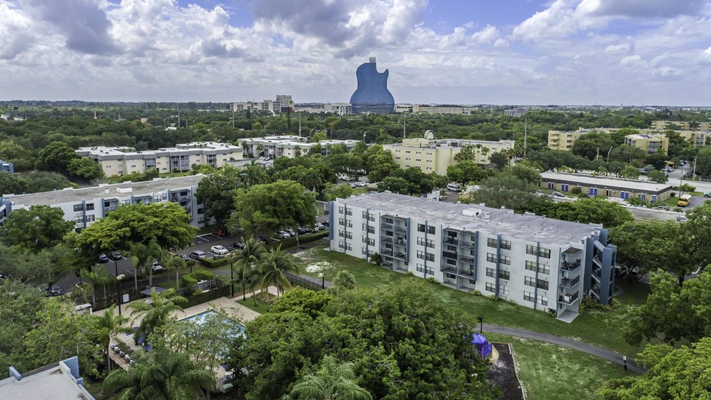 a cityscape with a large blue water tower in the background and apartment buildings in the foreground  at Club at Emerald Waters, Hollywood