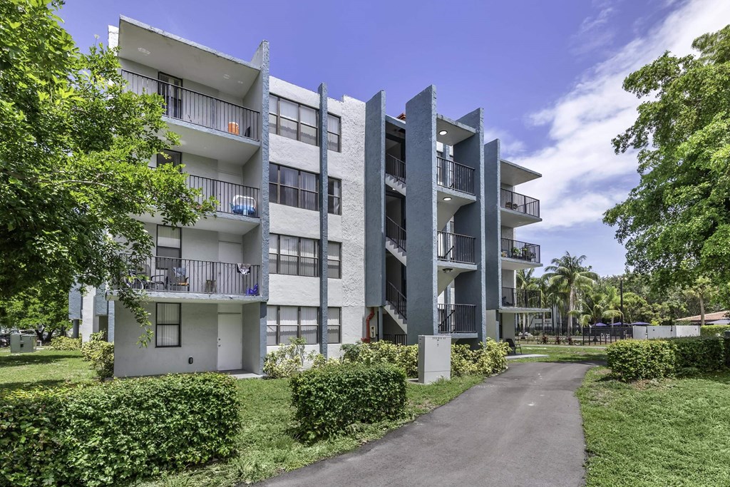 an image of an apartment complex with trees in the background  at Club at Emerald Waters, Florida, 33021
