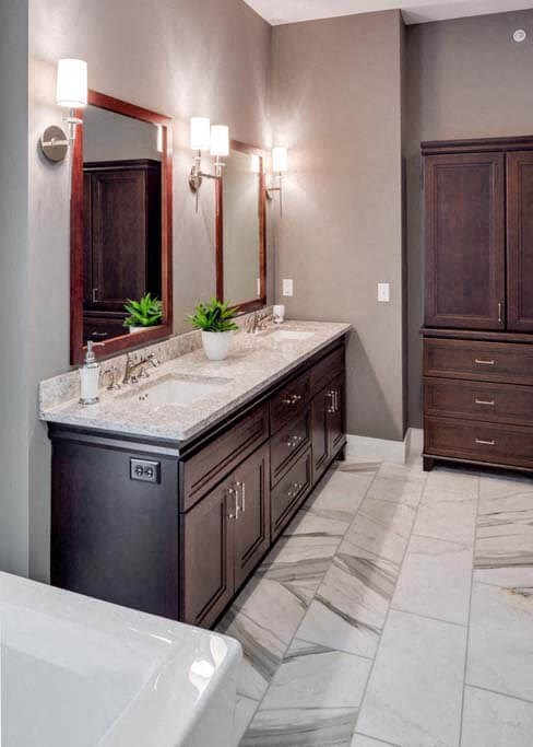 a bathroom with a sink a mirror and a tub