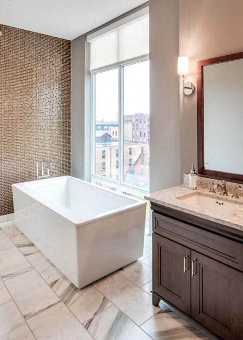 a bathroom with a bathtub and a sink