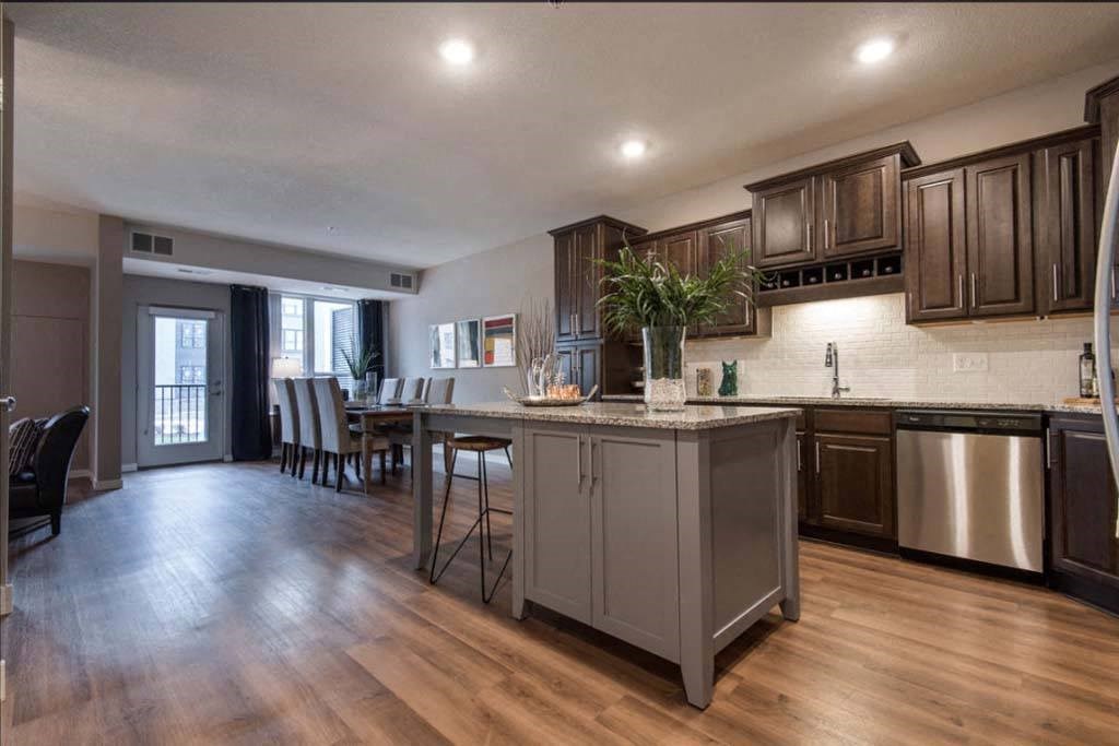 a kitchen with a large island in the middle of it
