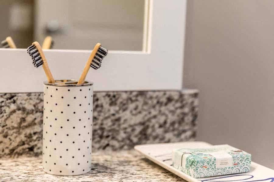 a toothbrush holder sitting on top of a counter