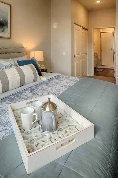 a bed with a tray on top of it