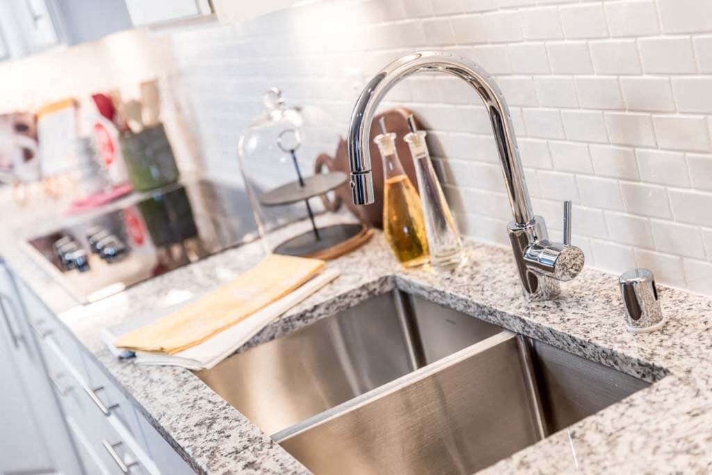 a kitchen with a sink and a faucet