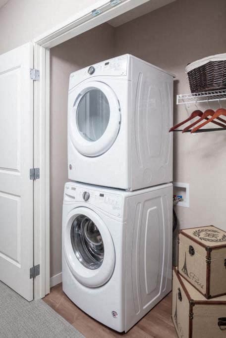 a washer and dryer are stacked on top of each other
