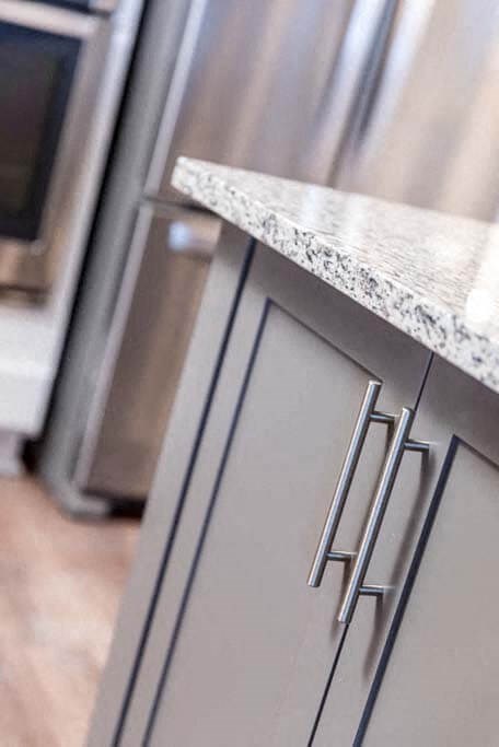 a kitchen with a counter top and a refrigerator