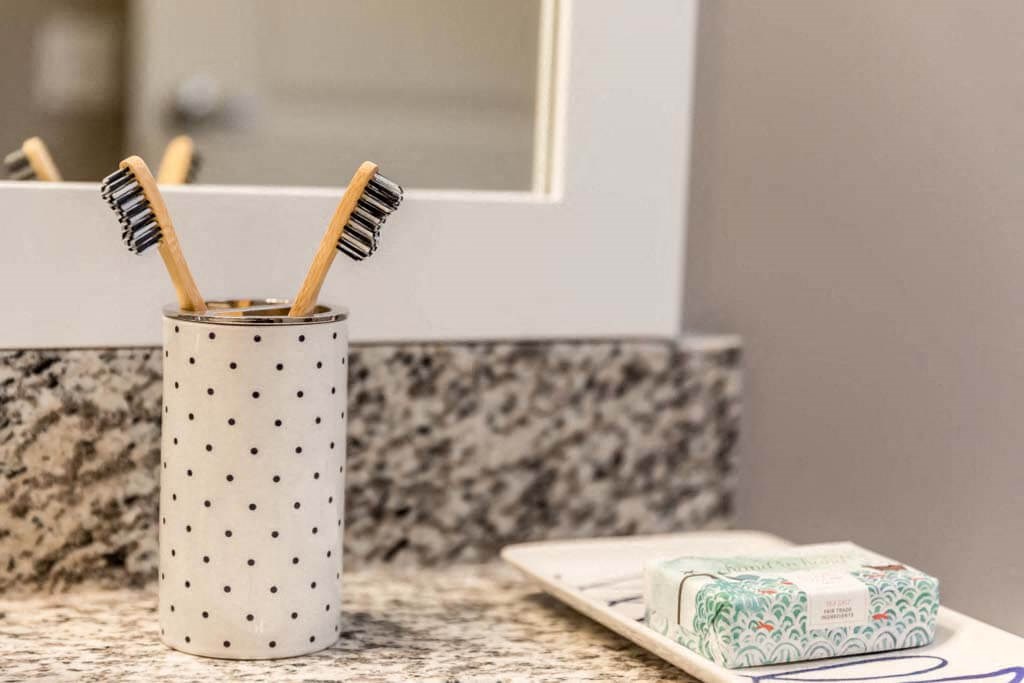 a toothbrush holder on a bathroom counter