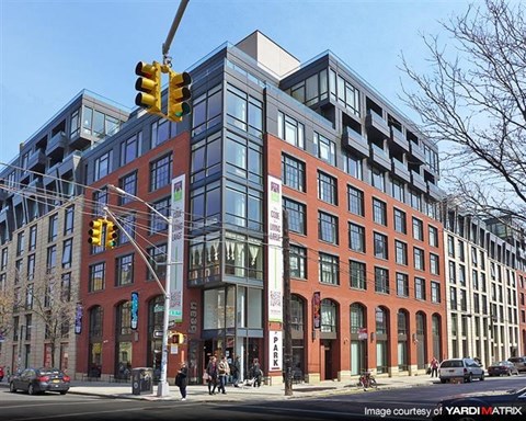 a large building on the corner of a city street