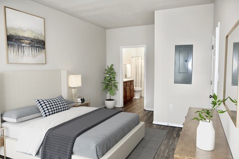 a bedroom with a bed and a bathroom