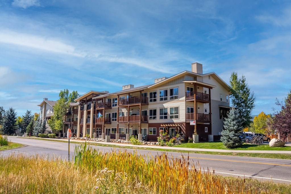 A large, modern building with a balcony on the second floor.