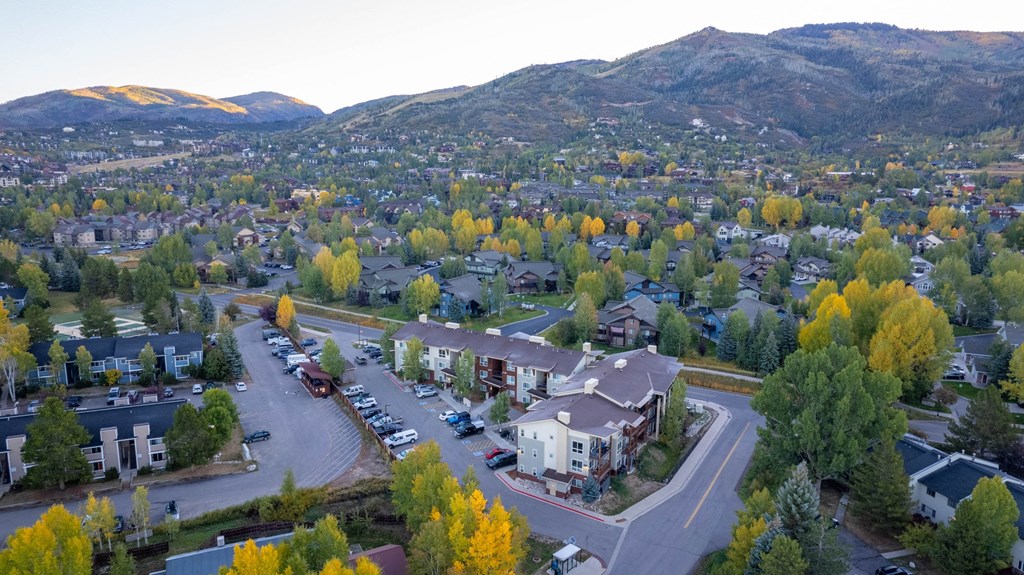 A small town with a mountain in the background.