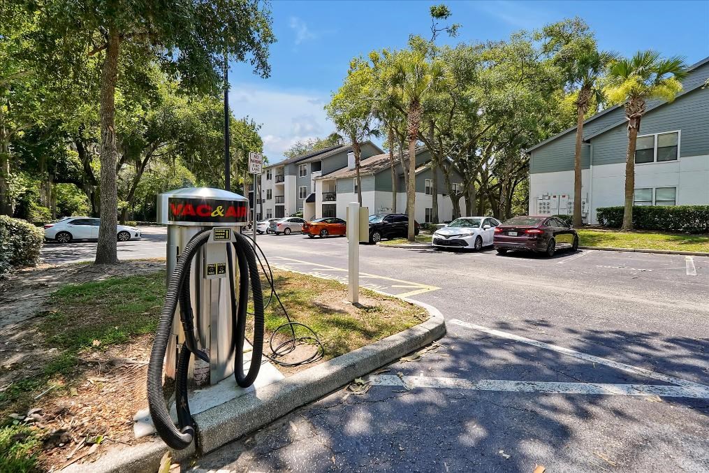 a gas pump sitting on the side of a street