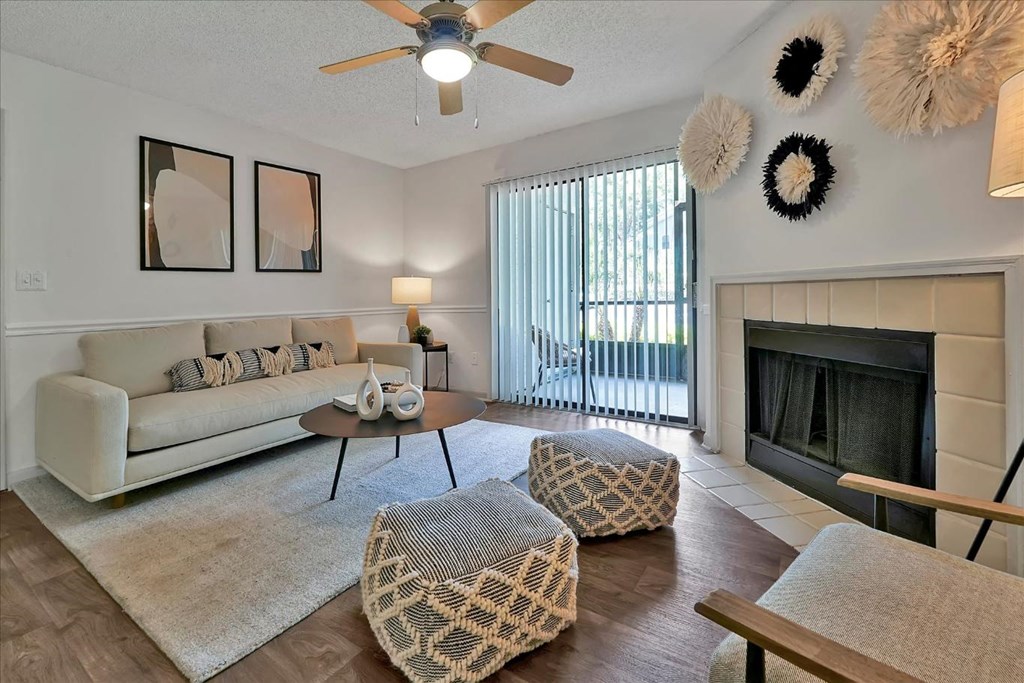 a living room with a couch and a fireplace