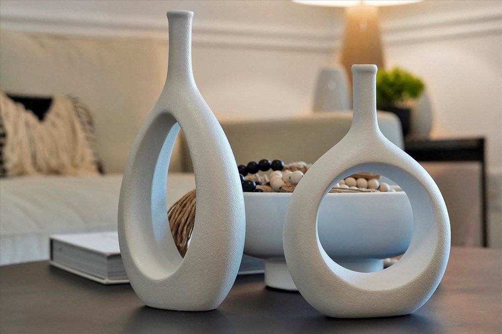 a couple of vases sitting on top of a table