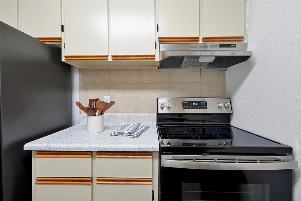 a kitchen with a stove and a counter top